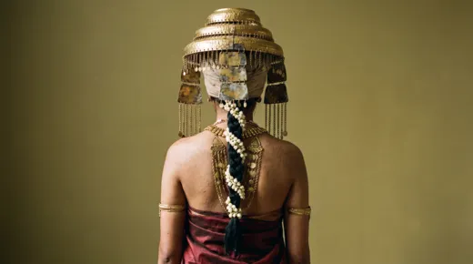 Gamini costume test: back view with a decorated spine ornament and hanging gold chains
